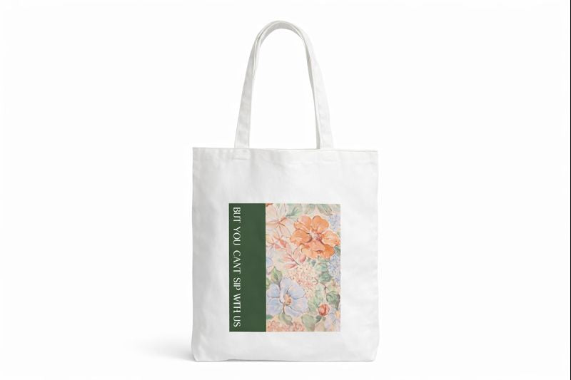 White tote bag with floral design and text on a white background