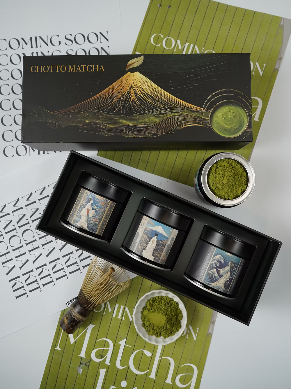 Matcha green tea set with packaging featuring Mount Fuji on a white background.